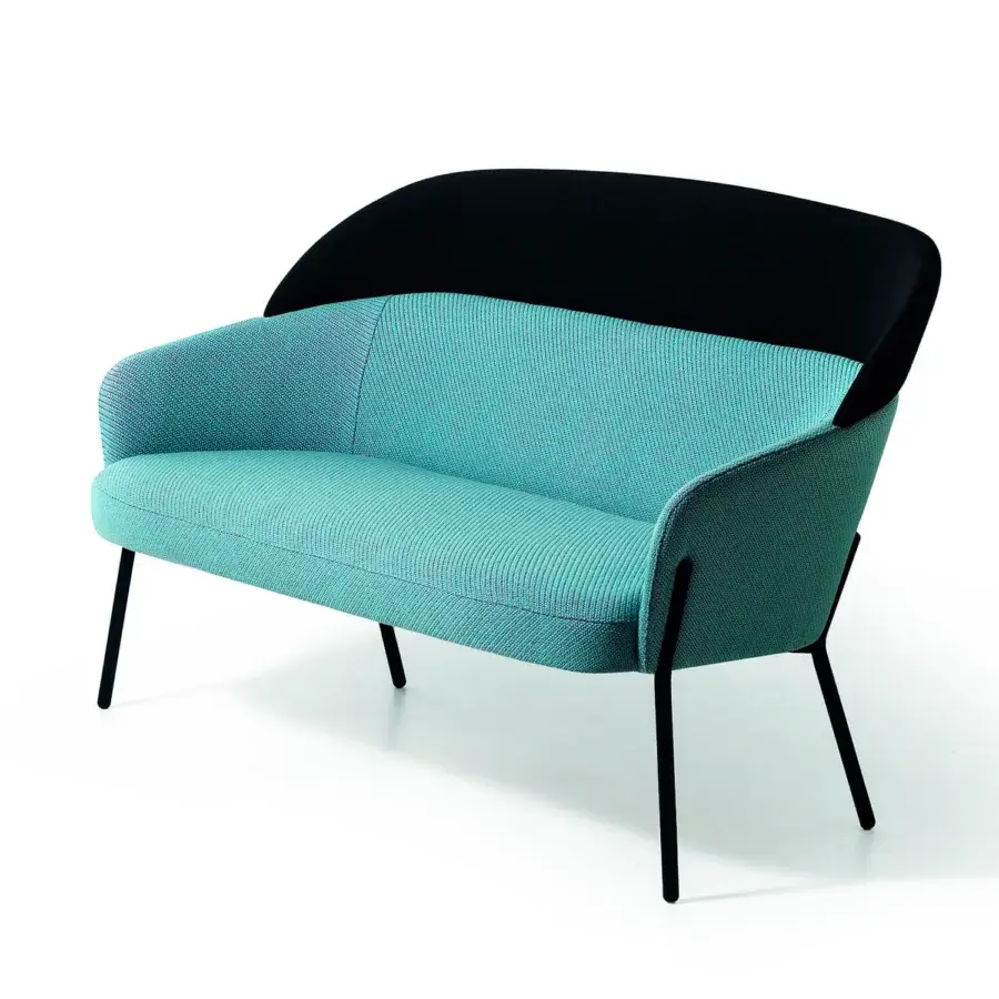 Superior Bross Wam sofa upholstered in textured light blue fabric with black metal legs and curved silhouette