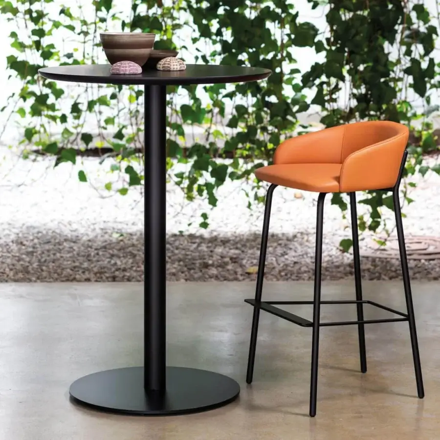Superior Bross Wam stool with matte black metal frame and light brown synthetic fabric upholstery