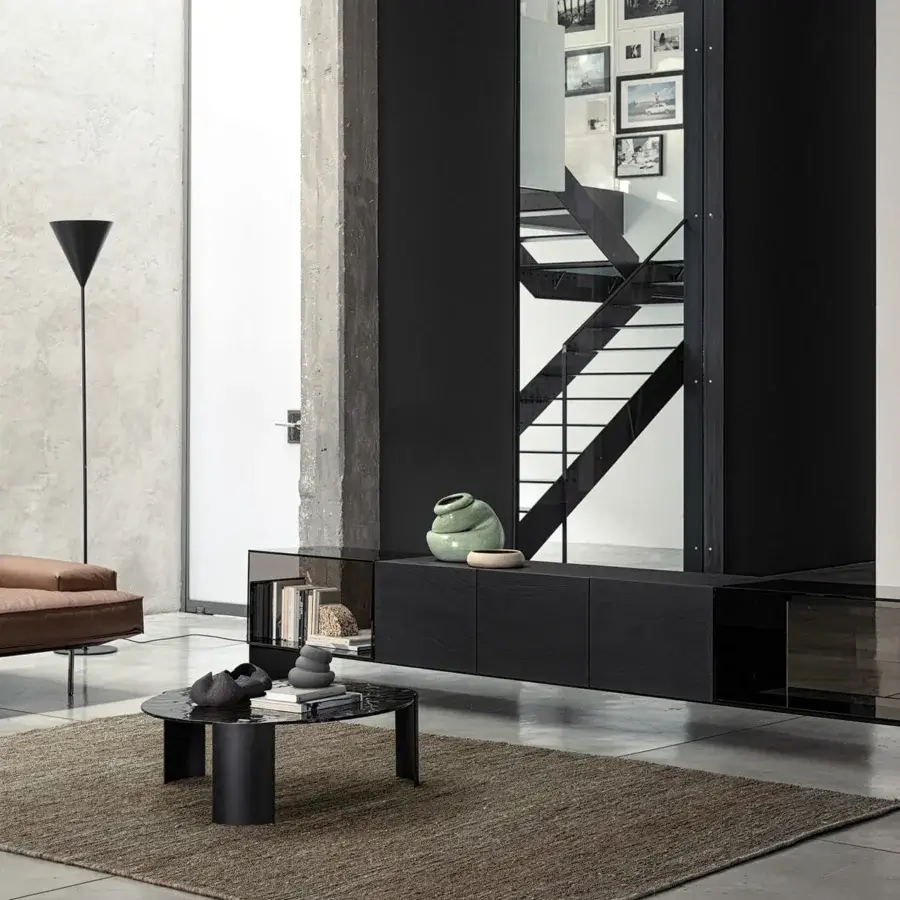 Distinguished Cierre1972 Riviera coffee table with dark toned glass top and sleek dark matte metal base