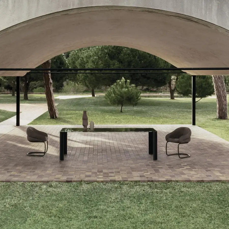 Captivating Cierre1972 Riviera table with glossy black glass top and cylindrical legs crafted in Italy