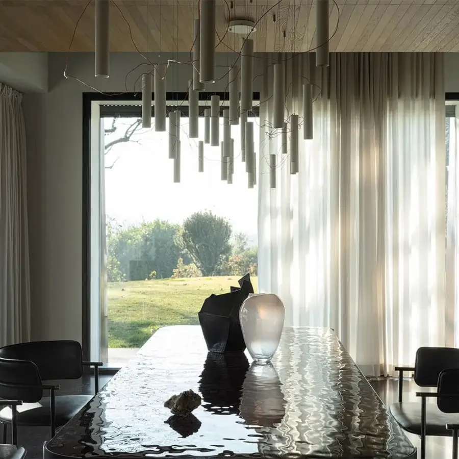 Distinguished Cierre1972 Riviera table with rippled glass top and round legs exhibiting unwavering stability