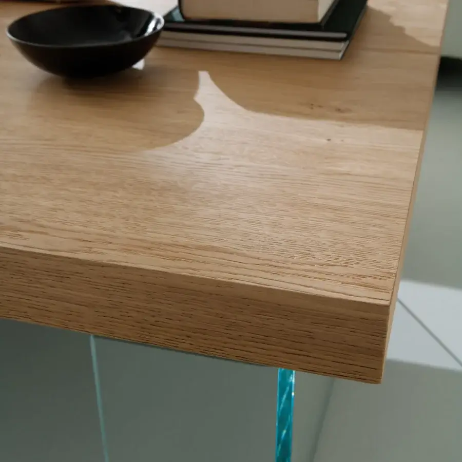 Superior Ozzio Italia Markus lift top coffee table with light brown wood and translucent blue tinted glass legs in a matte finish
