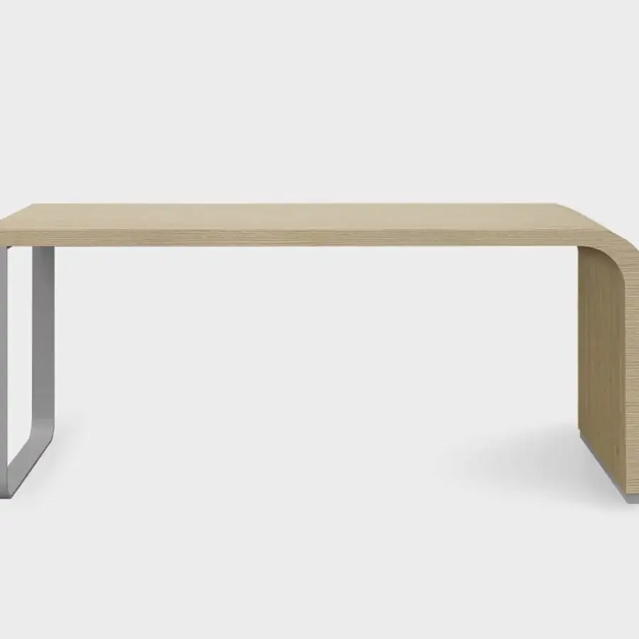 Innovative Lapalma Brunch desk with a curved honeycomb board top in a light, natural veneer and matte silver metal base