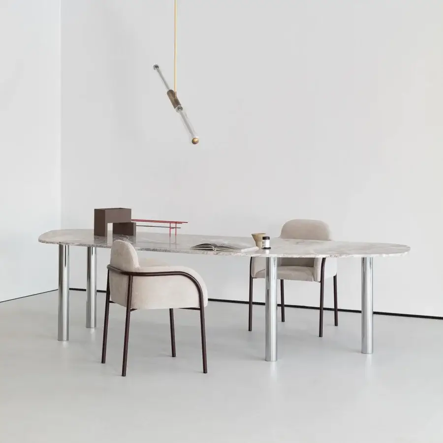 Elegant Cierre1972 Adele table with slim metal trim mirroring leather seams and glossy marbled finish