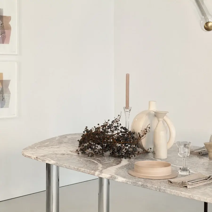 Captivating Cierre1972 Tango table with swirling gray, beige and white marble top and polished cylindrical metal legs
