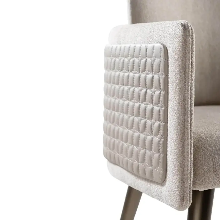 Distinguished Reflex Amet armchair with light beige textured fabric, quilted leather panel and dark oak legs