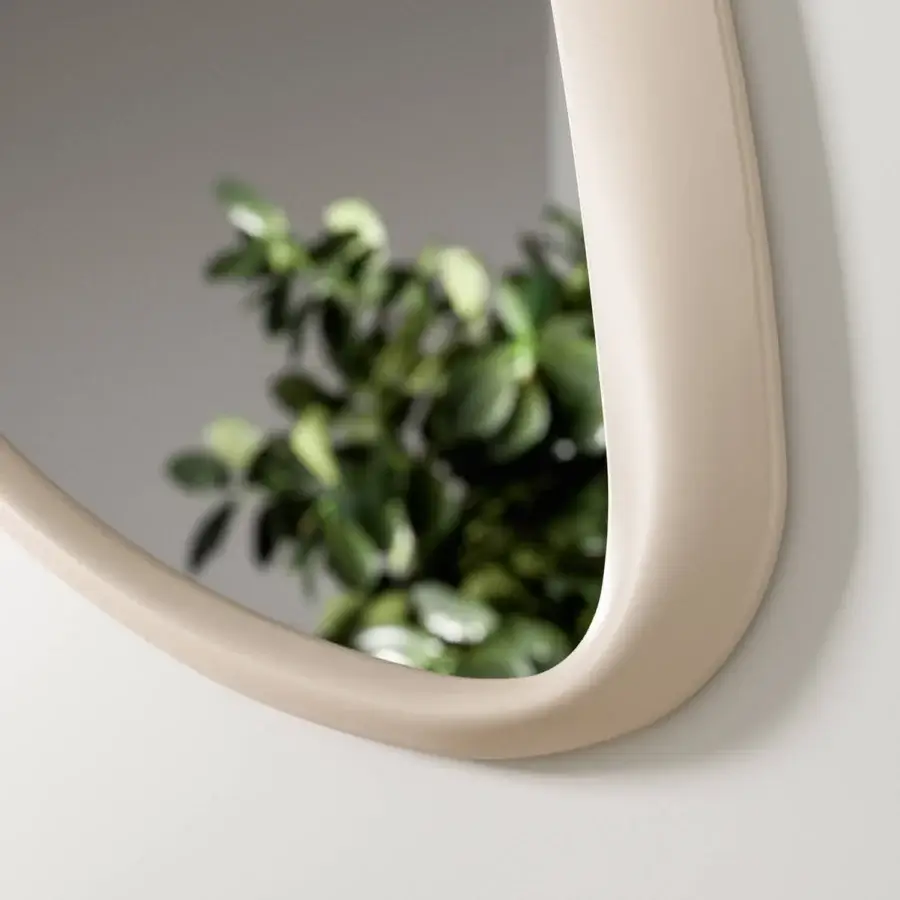 Superior Ozzio Italia Soho mirror with delicate asymmetric curves in light beige lacquered polyurethane frame