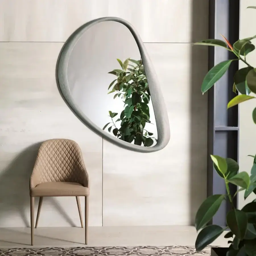 Elegant Ozzio Italia Soho mirror with delicate asymmetric curves in light gray lacquered polyurethane and matte finish