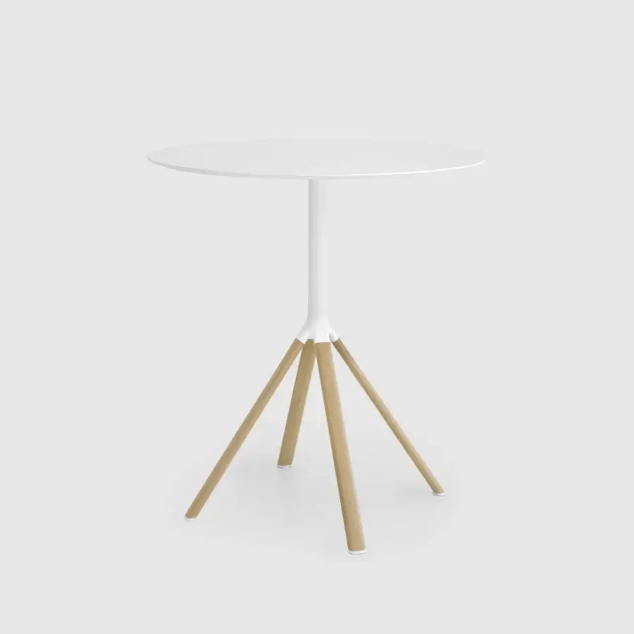 Distinguished Lapalma Fork bar table with a round white HPL Fenix® top and powder-coated white aluminum base crafted with light wood legs
