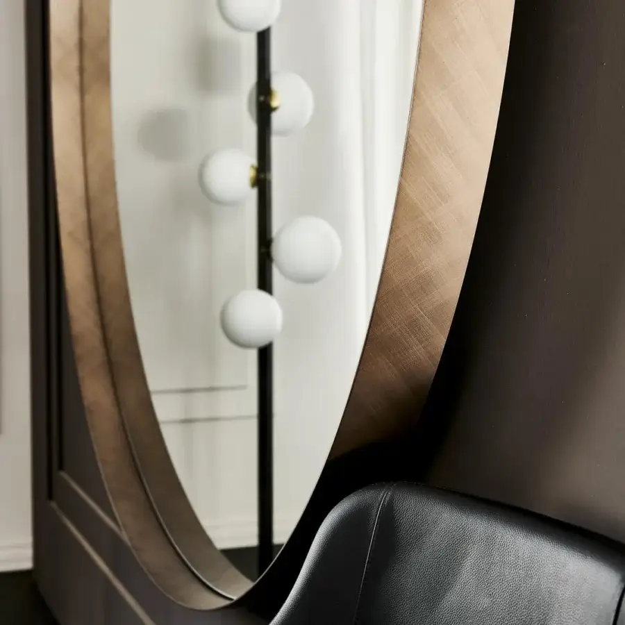 Distinguished Cattelan Italia Wish Magnum mirror crafted with brushed bronze finished steel in an oval silhouette