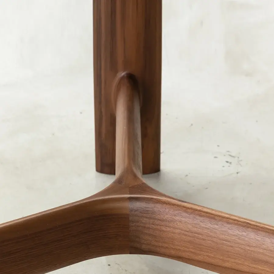 Elegant Bross River table with a smooth wood base and gracefully curving legs crafted in Italy
