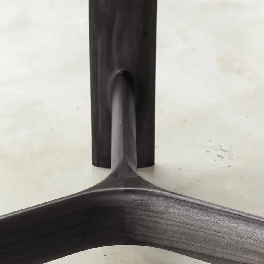 Distinguished Bross River table with organic lines and a dark finish crafted in Italy from high-end wood supporting a luxury top