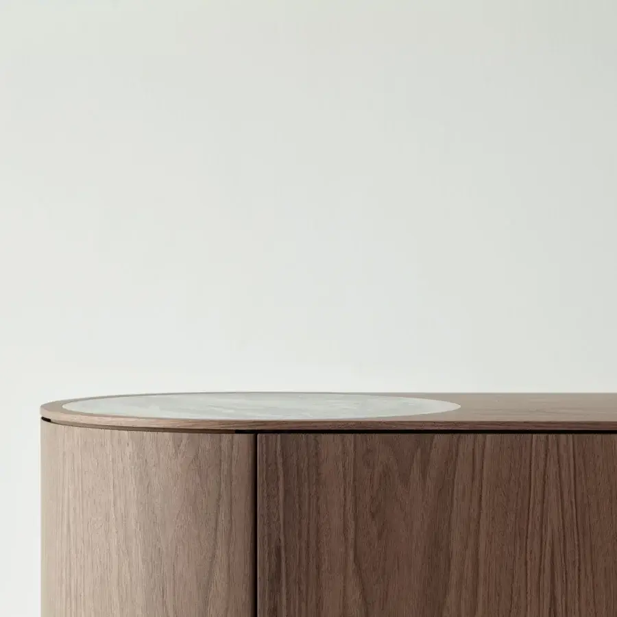 Elegant Cierre1972 Lip sideboard with rich brown wood and circular light-colored inset offering soft curves