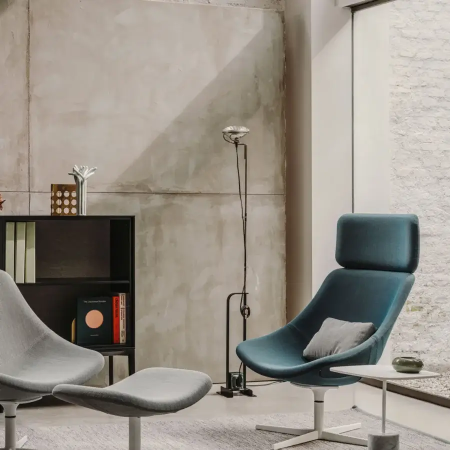 Distinguished Lapalma Auki lounge chair with headrest upholstered in teal-blue textile with a powder-coated aluminum swivel base