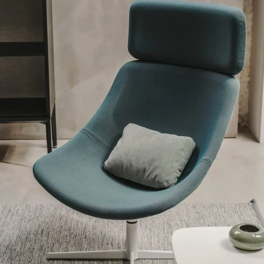 Elegant Lapalma Auki lounge chair with headrest upholstered in textured teal textile with a light gray cushion and powder coated metal base