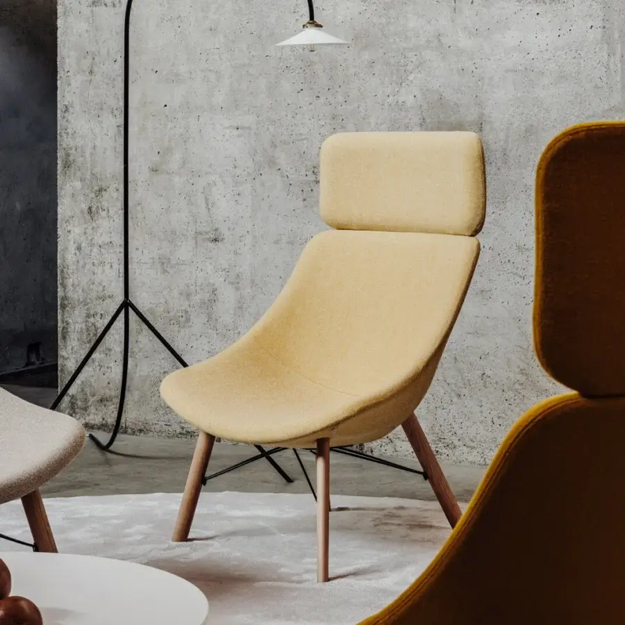Superior Lapalma Auki lounge chair with headrest upholstered in light yellow textile with smooth matte ash wood legs