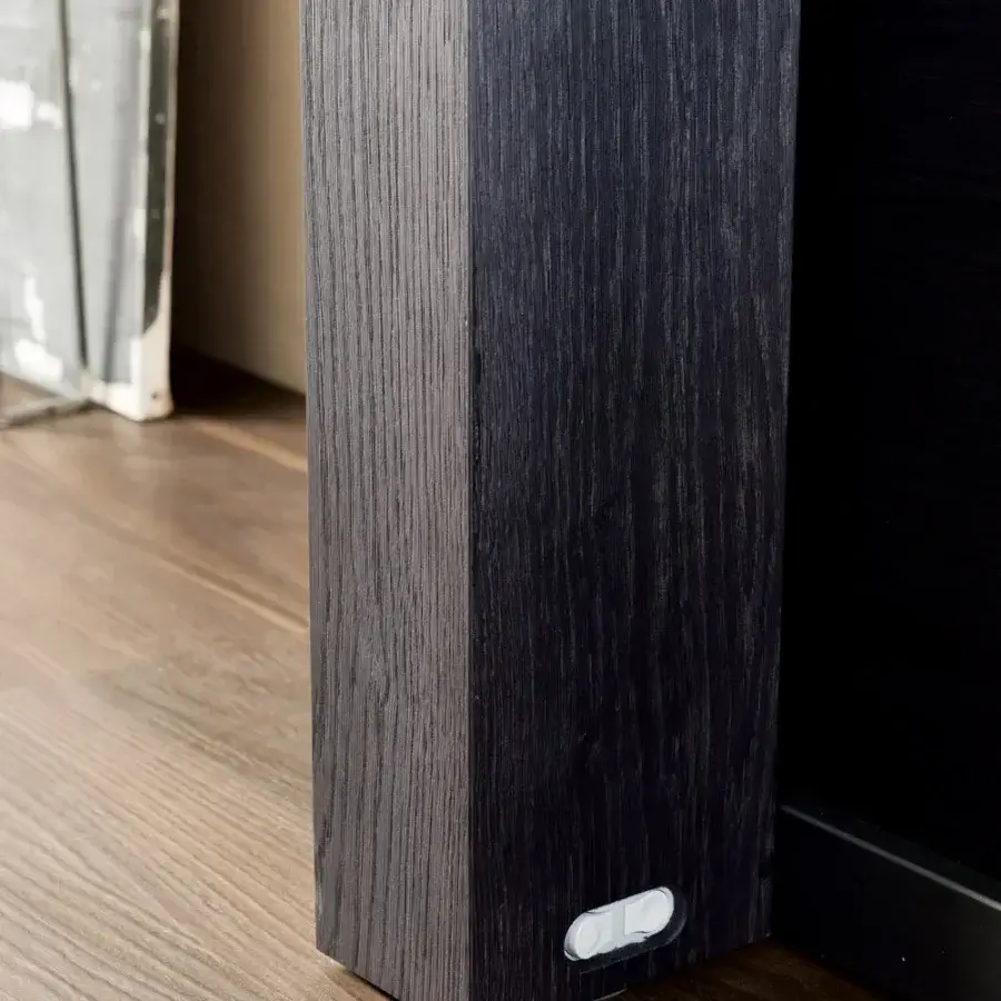 Elegant Ozzio Italia A3 console to table crafted in wood with a dark textured finish and lighter gray accents