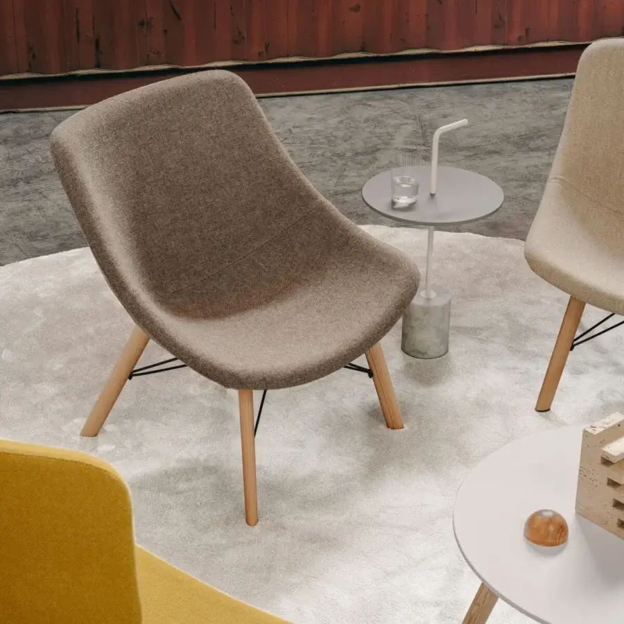Exceptional Lapalma Auki lounge chair with sinuous form upholstered in textured brown textile and light-toned solid ash wood base