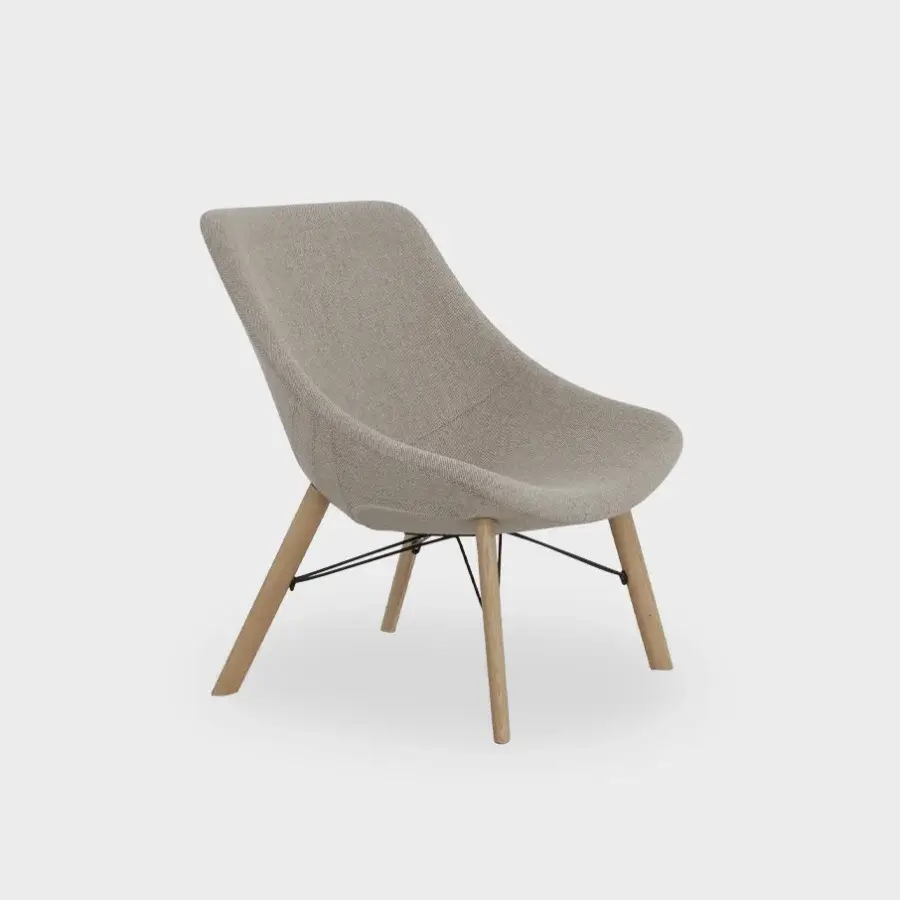 Distinguished Lapalma Auki lounge chair with sinuous form upholstered in textured light beige and built with solid ash wood with black metal supports