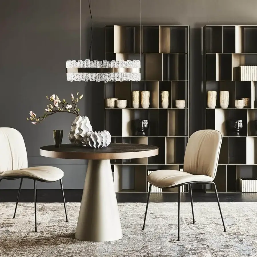 Distinguished Cattelan Italia Saturno table with Marmi Makalu ceramic top and matte light beige embossed lacquered steel pedestal base