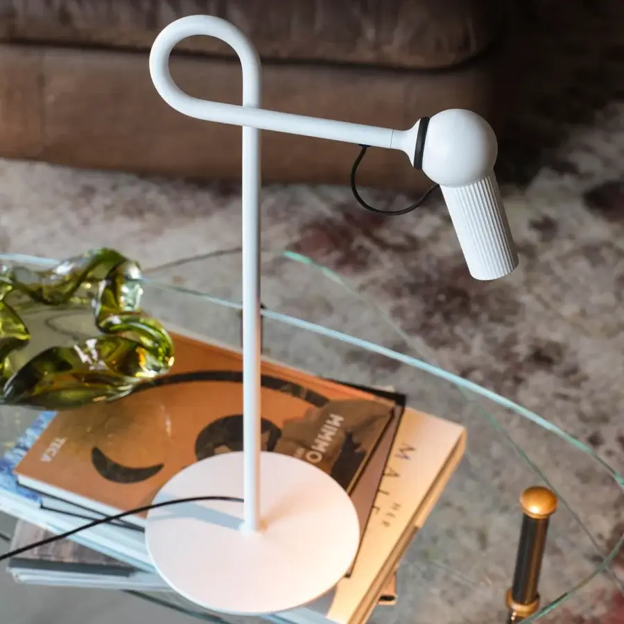 Elegant Kundalini Bird table lamp with die-cast varnished aluminum head and premium coated metal structure