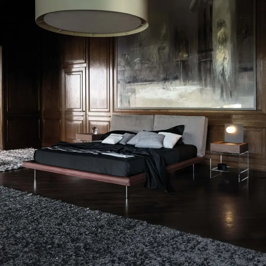 Distinguished Cierre1972 Divine bed with dark brown leather-like frame and gray upholstery, built with reflective metal legs