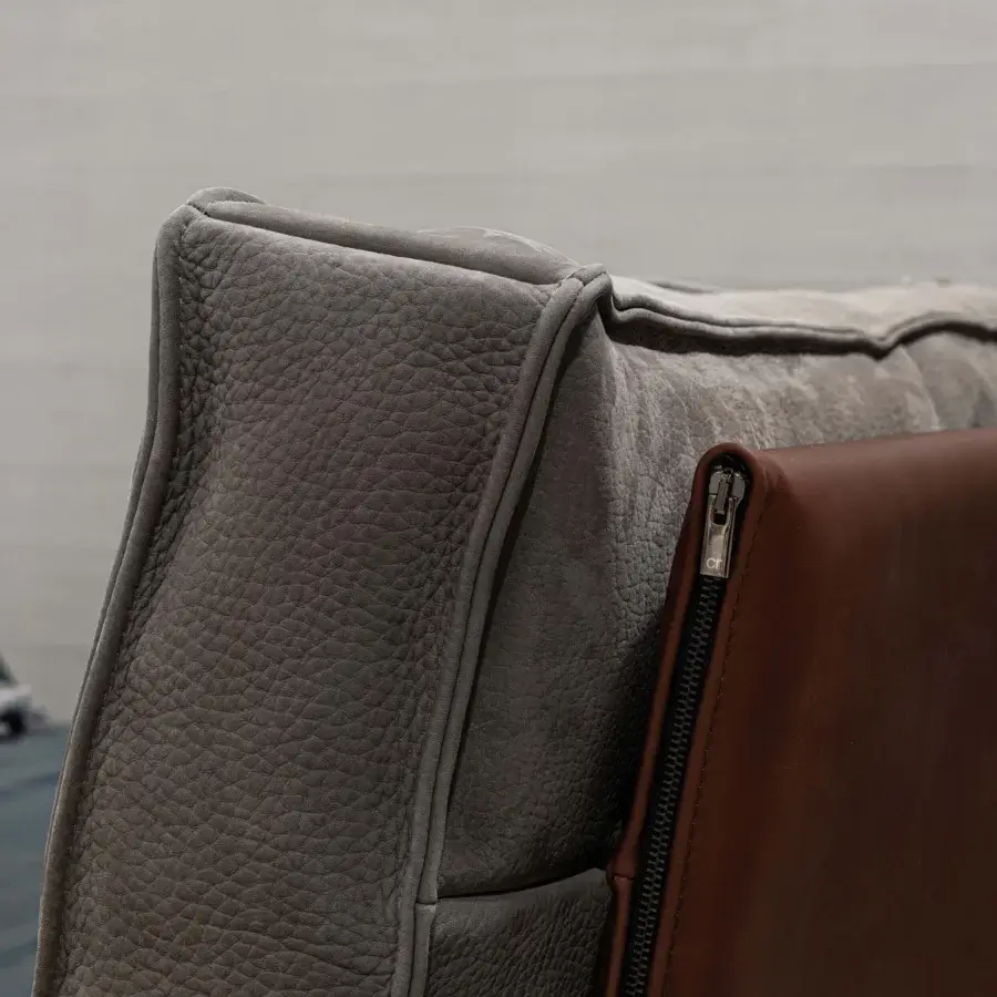 Exceptional Cierre1972 Divine bed crafted in textured matte grey textile with brown leather panel and precise stitching