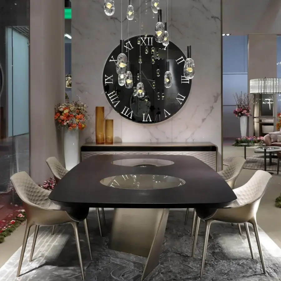 Exclusive Reflex Esse table crafted with Canaletto walnut, curved extra clear glass bases, satin Brass finish and built-in Mesh glass Lazy Susan plates