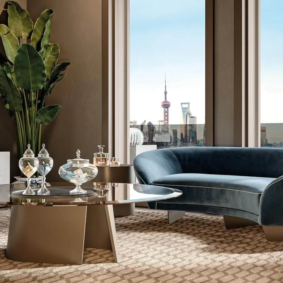 Distinguished Reflex Esse table with beveled bronze glass top and trapezoidal light brownish-gray finished base