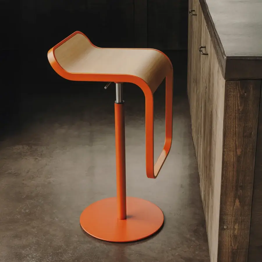 Innovative Lapalma Lem stool with vibrant orange plywood seat and metal frame built with a smooth finish