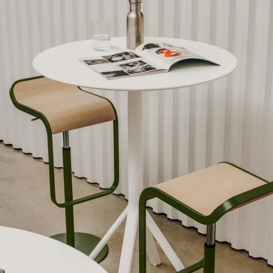 Elegant Lapalma Lem stool with curved silhouette, light wood seat and dark green powder-coated metal frame