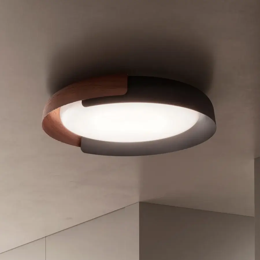 Distinguished Kundalini Dala ceiling lamp with an open, clover-like structure in dark gray metallic coating and warm wood-like accents