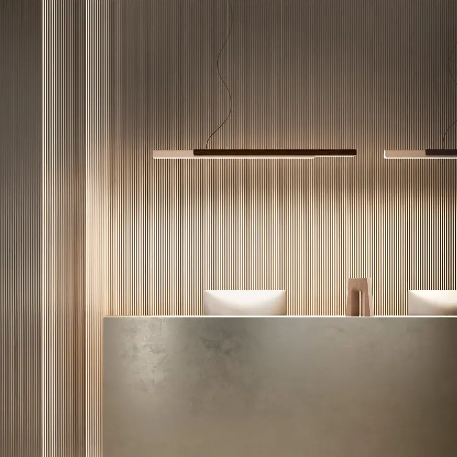 Distinguished Kundalini Dala Linear suspension lamp crafted in Italy with a metallic coated structure and contrasting dark brown hues