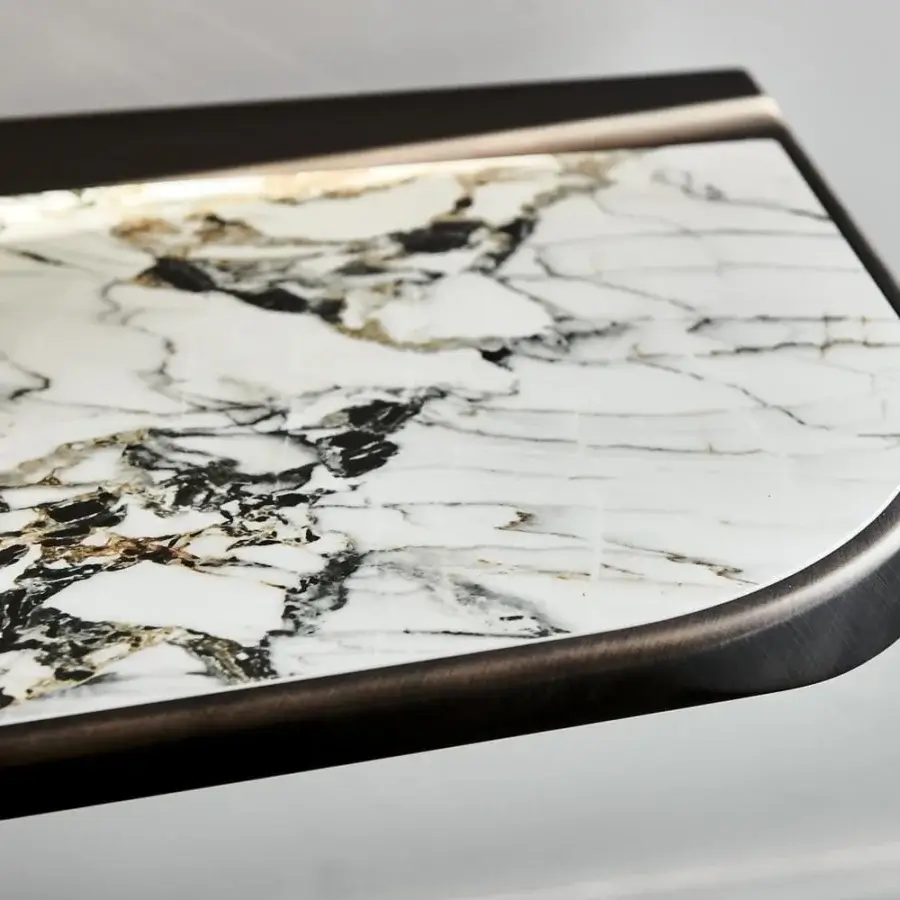 Elegant Cattelan Italia Terminal Keramik console with white marble and contrasting black, brown veining in brushed bronze trim