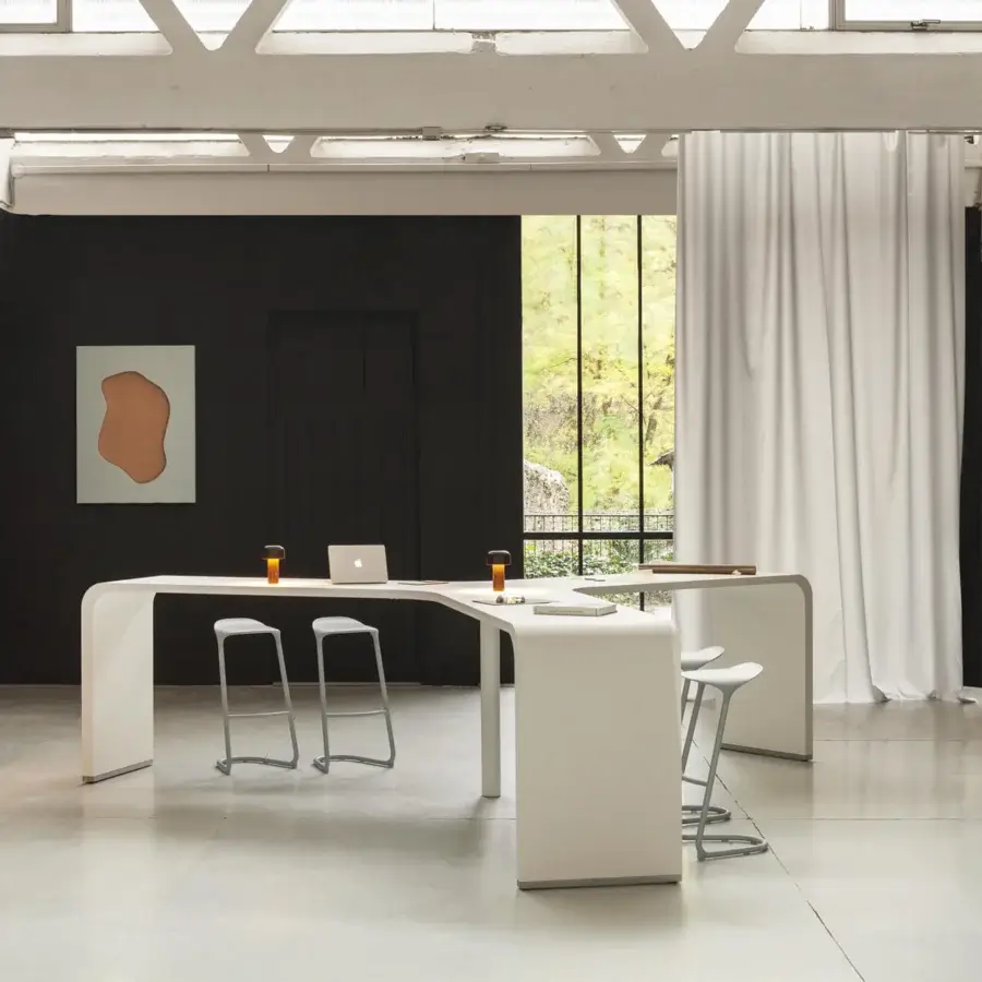 Elegant Lapalma Brunch workstation in white laminate with powder-coated white metal base and curvilinear form