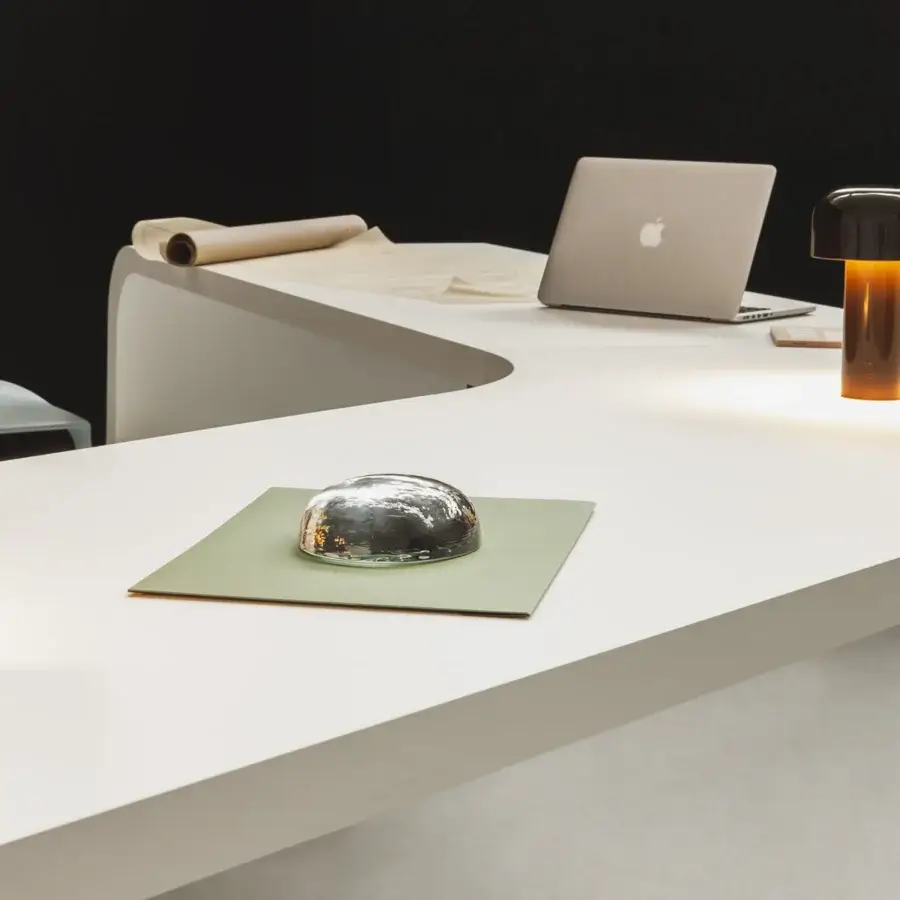 Superior Lapalma Brunch workstation with a wide white tabletop in Fenix® and curved white powder-coated metal base for clean workspace organization