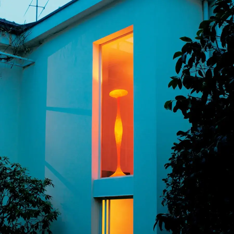 Superior Kundalini E.T.A floor lamp with a sinuous ecological fiberglass light diffuser and smooth orange finish