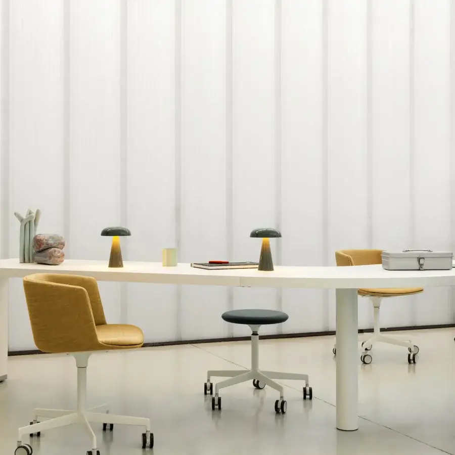 Innovative Lapalma Brunch workstation presents a curved white laminate top with a matte powder-coated metal base