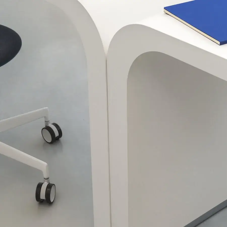 Exceptional Lapalma Brunch workstation showcases a curved white laminate tabletop with a powder coated metal base and smooth matte finish