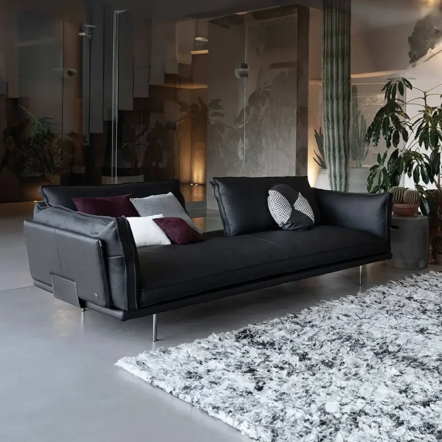 Elegant Cierre1972 Divine sofa upholstered in solid black leather with matte finish and customizable backrest