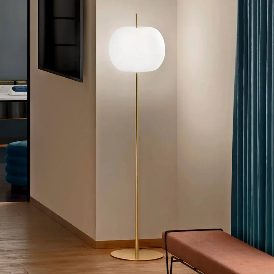 Superior Kundalini Kushi XL floor lamp with spherical opal glass diffuser and glossy golden metallic body