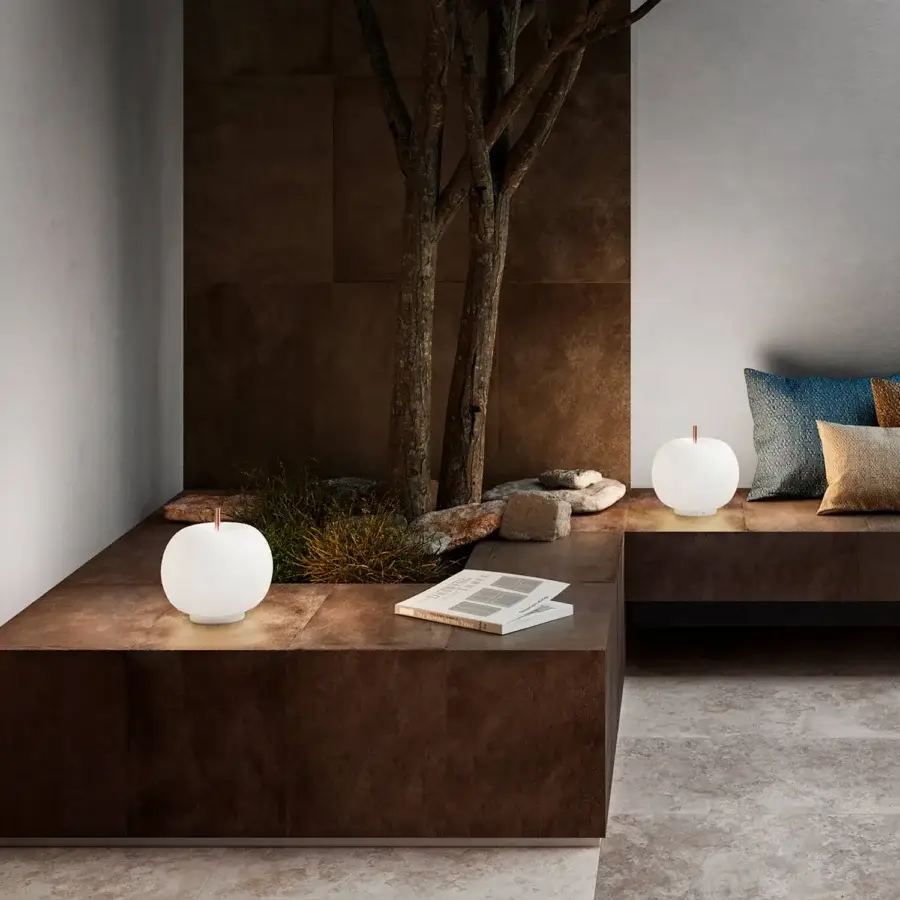 Exceptional Kundalini Kushi table lamp with spherical opal diffuser and black coated metallic body