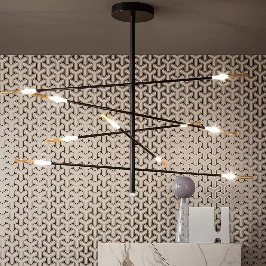 Elegant Bonaldo Crossroad suspension lamp with crisscrossing metal arms and amber-colored glass elements in matt lead lacquer