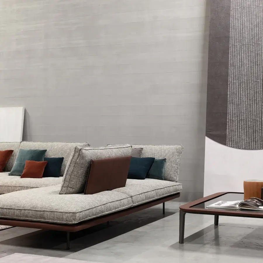 Innovative Cierre1972 Divine sectional with light grey textured textile, adjustable backrest and decorative throw pillows