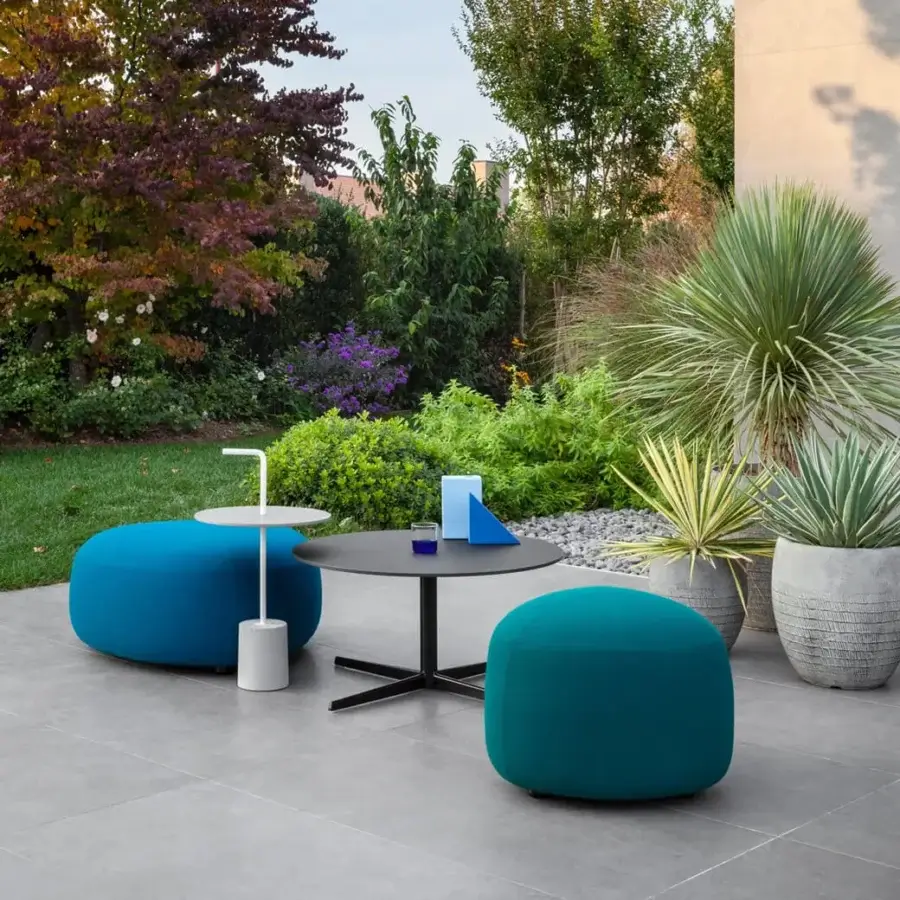 Exceptional Lapalma Kipu Outdoor ottoman with rounded triangular form crafted in teal water-resistant outdoor fabric with smooth matte finish