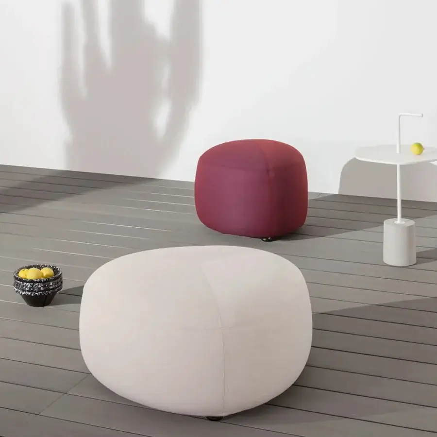Elegant Lapalma Kipu outdoor ottoman with rounded form upholstered in light beige water-resistant fabric and marine plywood base
