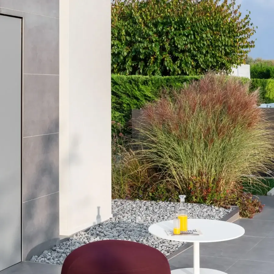 Distinguished Lapalma Kipu outdoor ottoman with organic rounded form in deep maroon water-resistant textile and matte finish