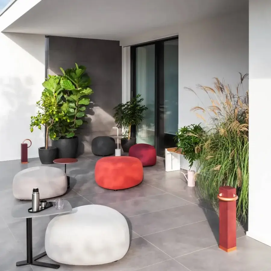 Captivating Lapalma Kipu outdoor ottoman with rounded triangular shape upholstered in vibrant red UV-stable fabric