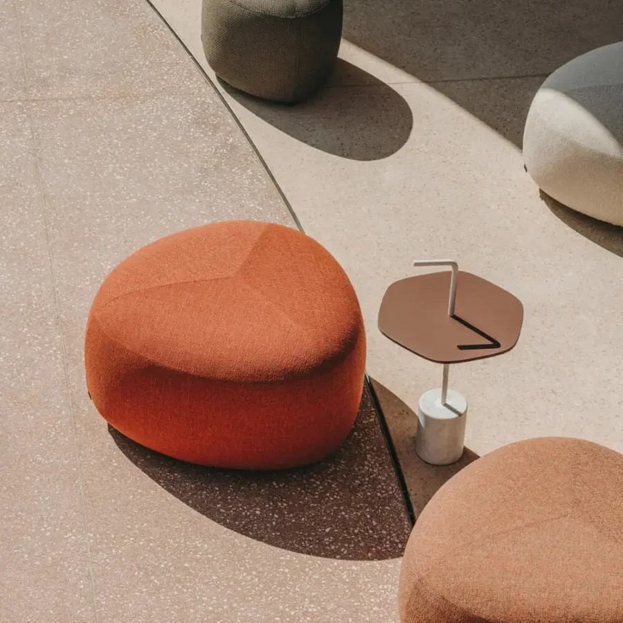 Distinguished Lapalma Kipu outdoor ottoman with rounded triangular shape upholstered in textured matte fabric with muted hues