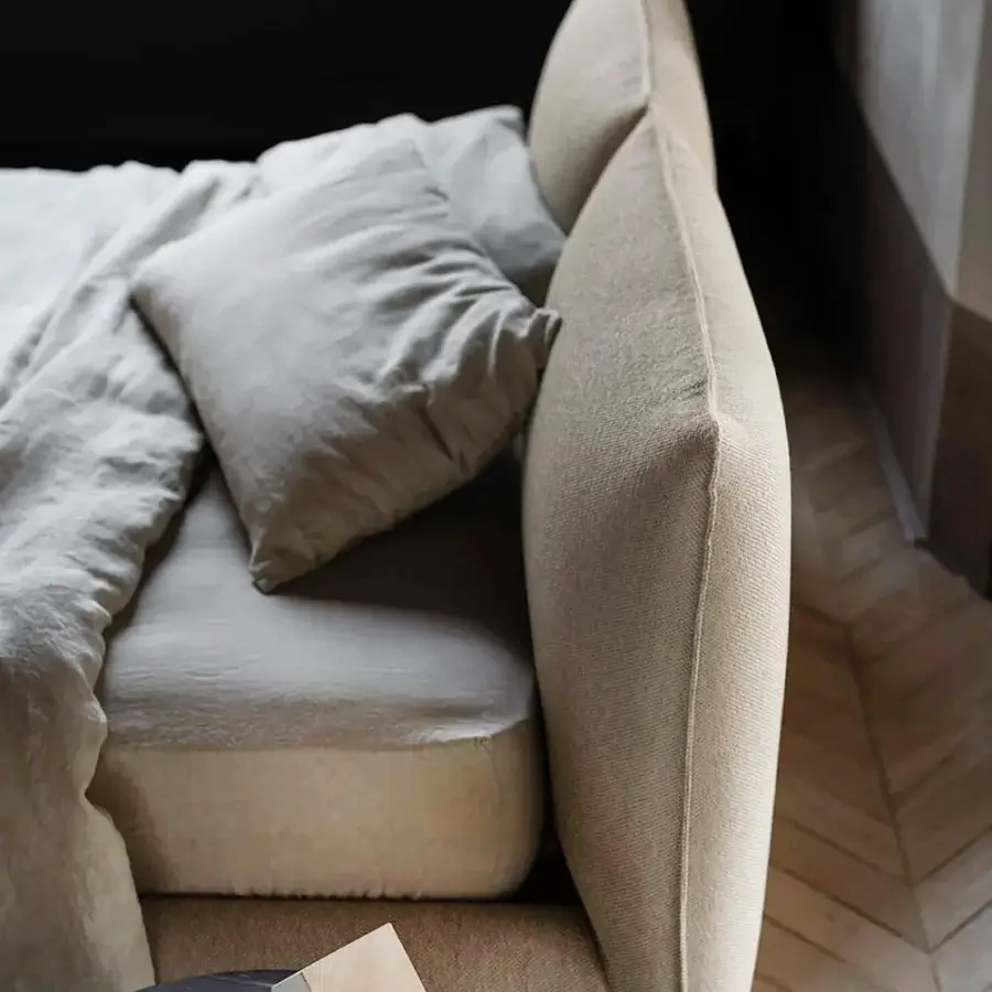 Sophisticated Bolzan Letti Venus bed with cushioned headboard and light beige textured textile upholstery crafted in Italy